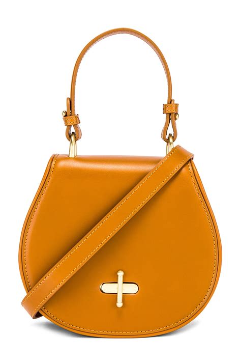 Sancia The Paloma Saddle Bag in Cognac .